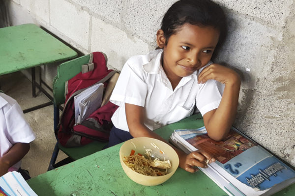 Child eating lunch during school break