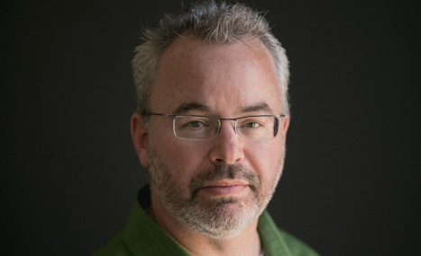 Headshot of Paul Gillam wearing glasses