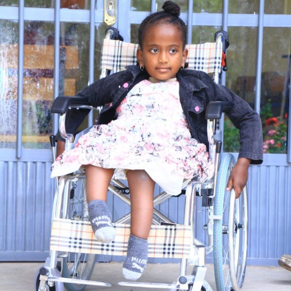 Young girl in a wheelchair.